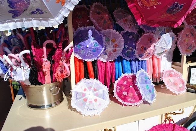 walt disney world magic kingdom shopping personalized merchandise hand drawn umbrellas